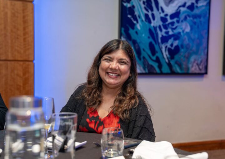 Smiling woman at a table