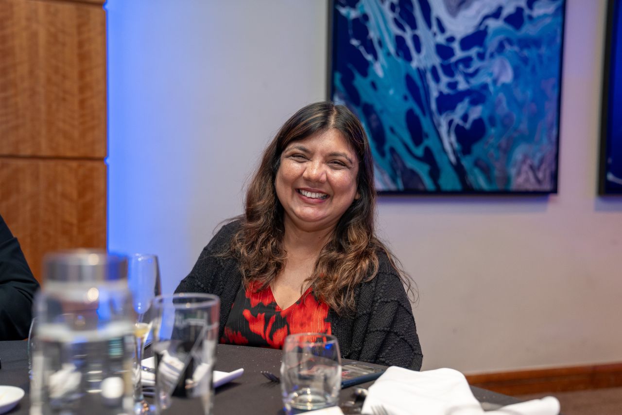 Smiling woman at a table