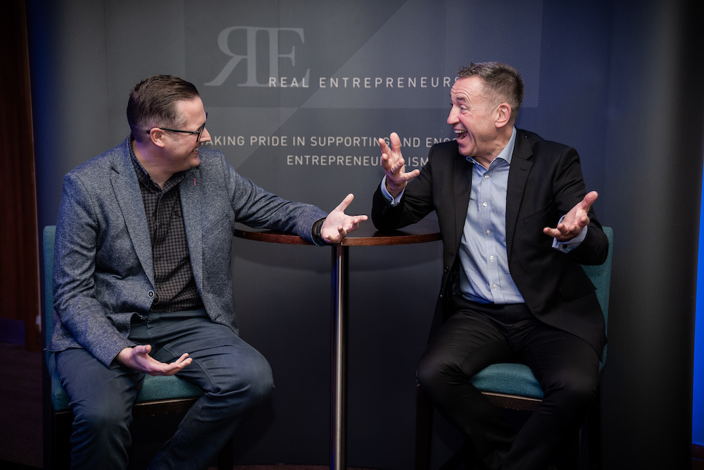 Two business men laughing at the East Midlands Real Entrepreneurs' Club